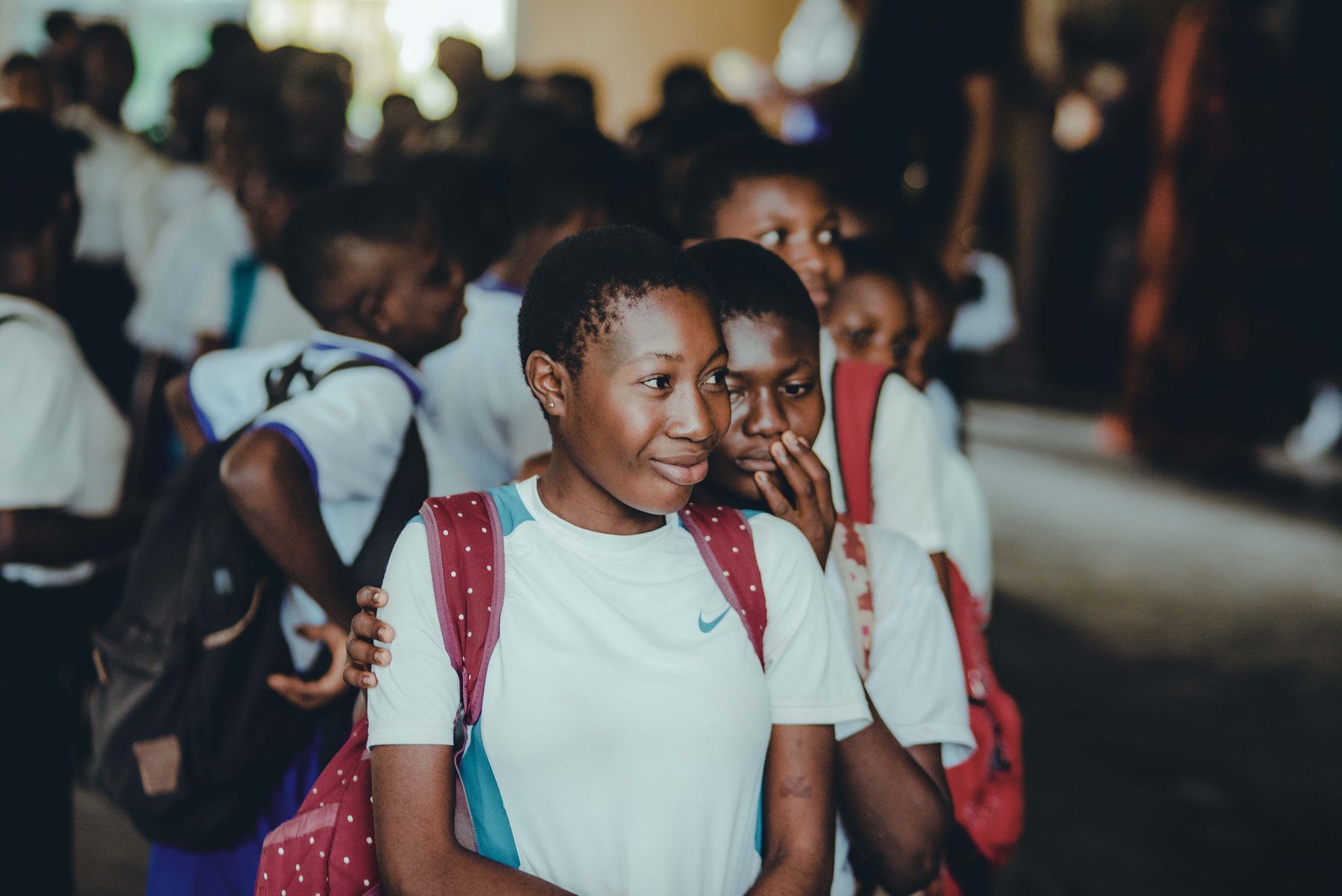 Smiling school students gathered together