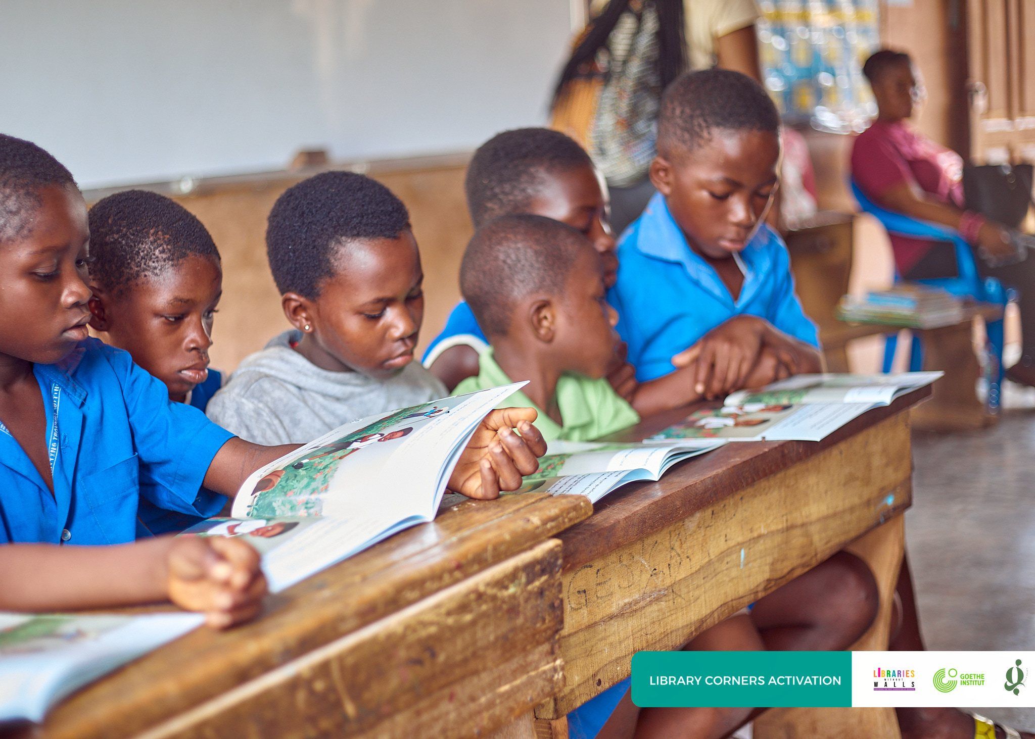 A group of pupils reading picture books together in class