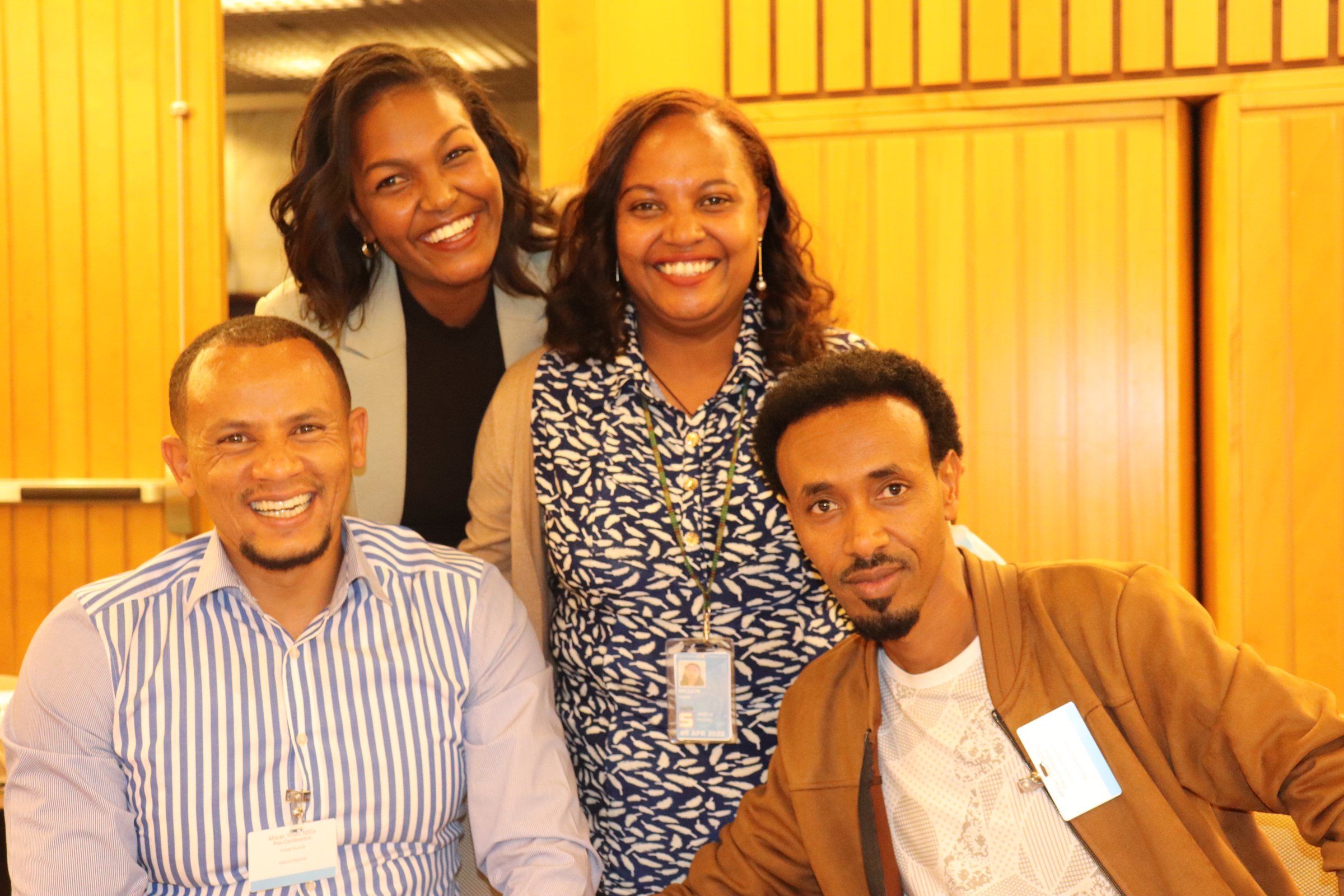 Four library leaders smiling together at a Library Aid Africa workshop