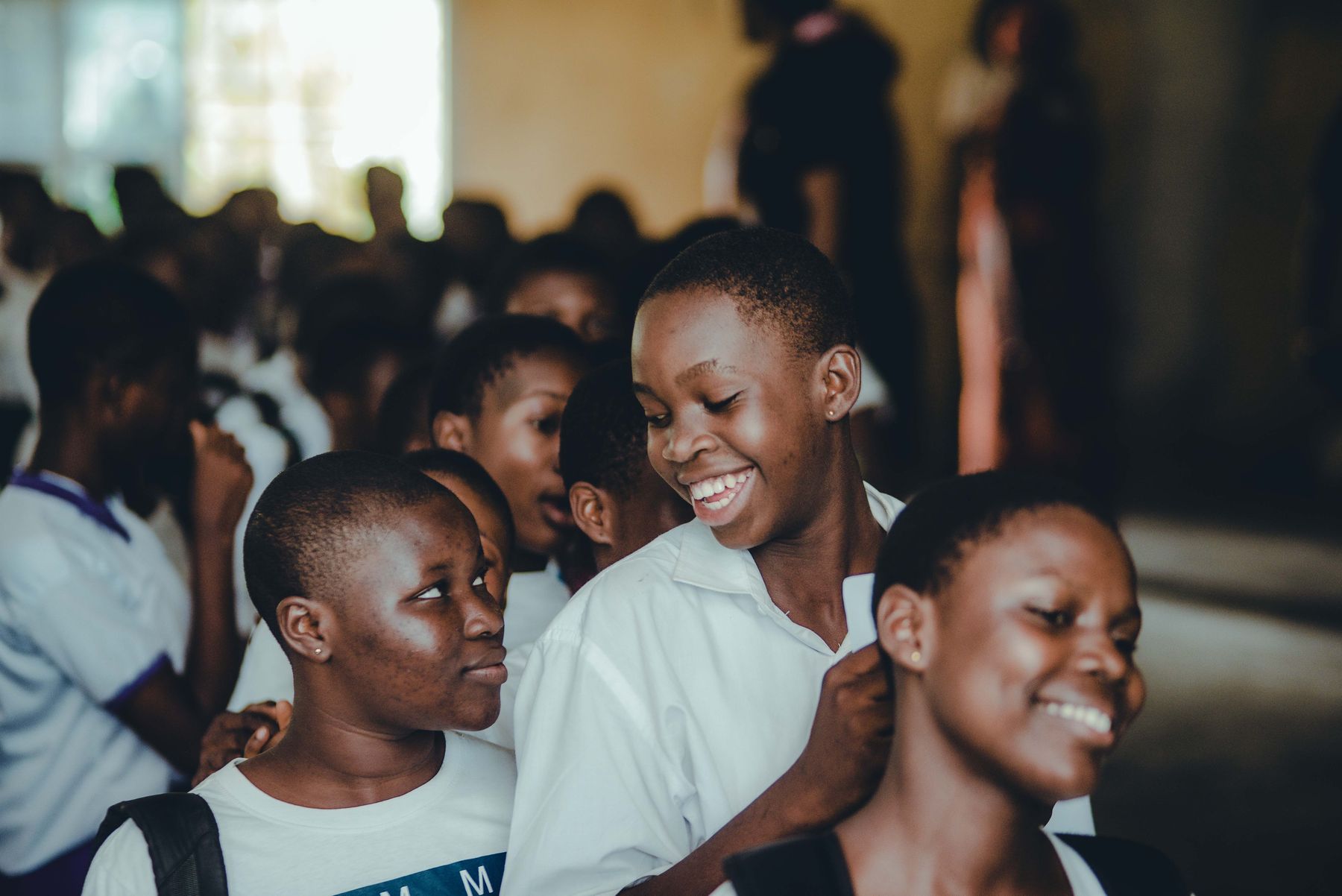 Smiling secondary school students together